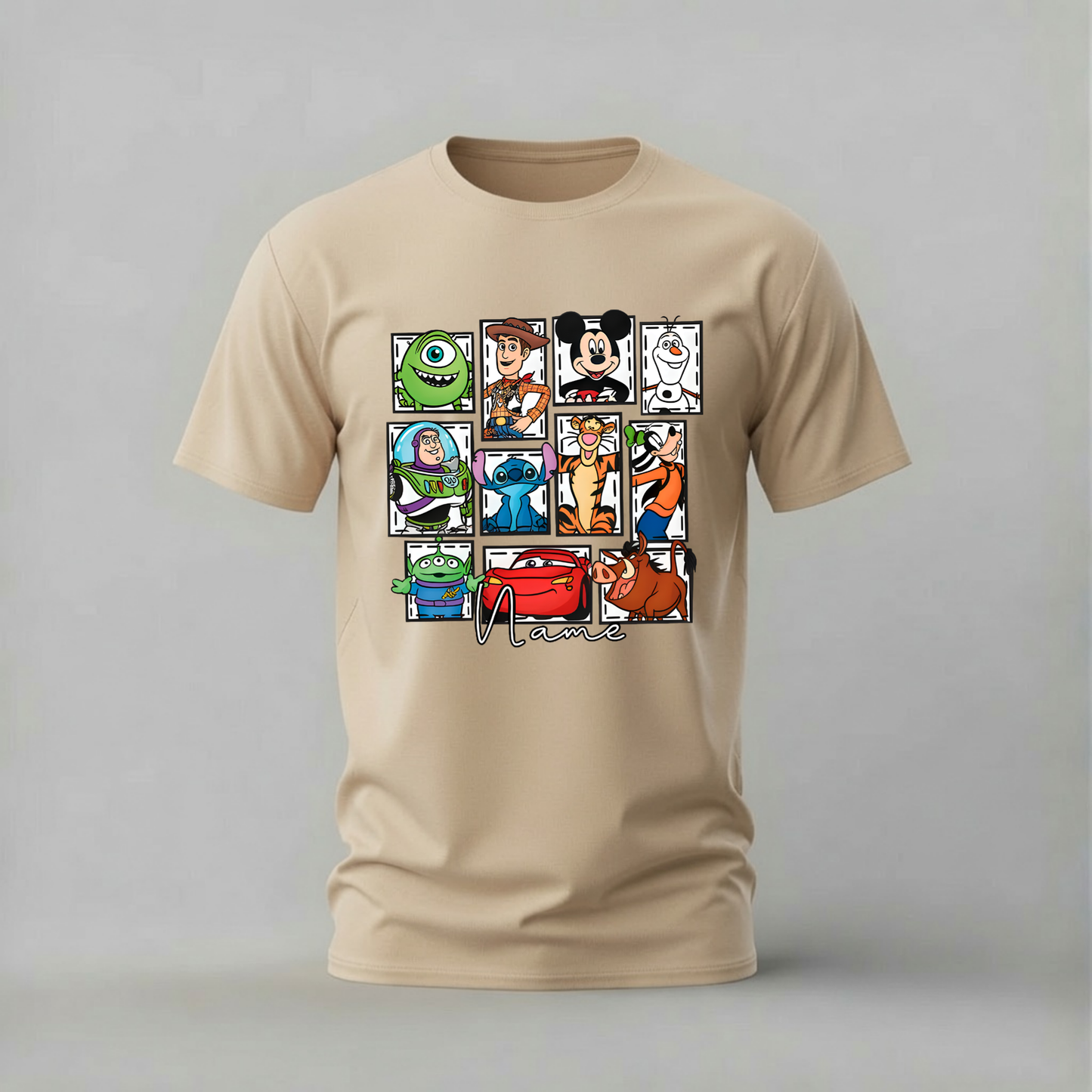 A beige crewneck t-shirt featuring a graphic collage of Disney characters including Mickey Mouse, Buzz Lightyear, Woody, Stitch, and others, with the text 'Disney' printed below the grid, shown on a neutral gray background.