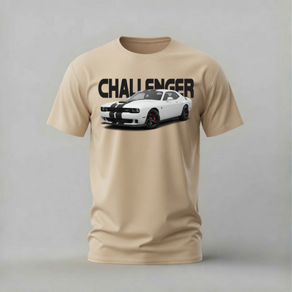 A beige crewneck t-shirt featuring a graphic print of a white Dodge Challenger with black racing stripes and the word 'CHALLENGER' printed in bold black letters above it, displayed on a neutral gray background.