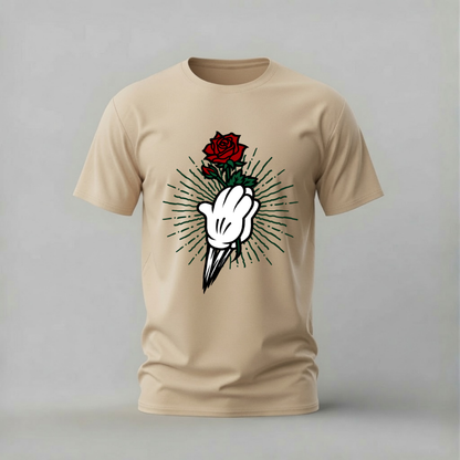 A beige short-sleeve crewneck t-shirt featuring a graphic print of a white hand holding a red rose with black and green rays radiating from it, displayed on a neutral gray background.