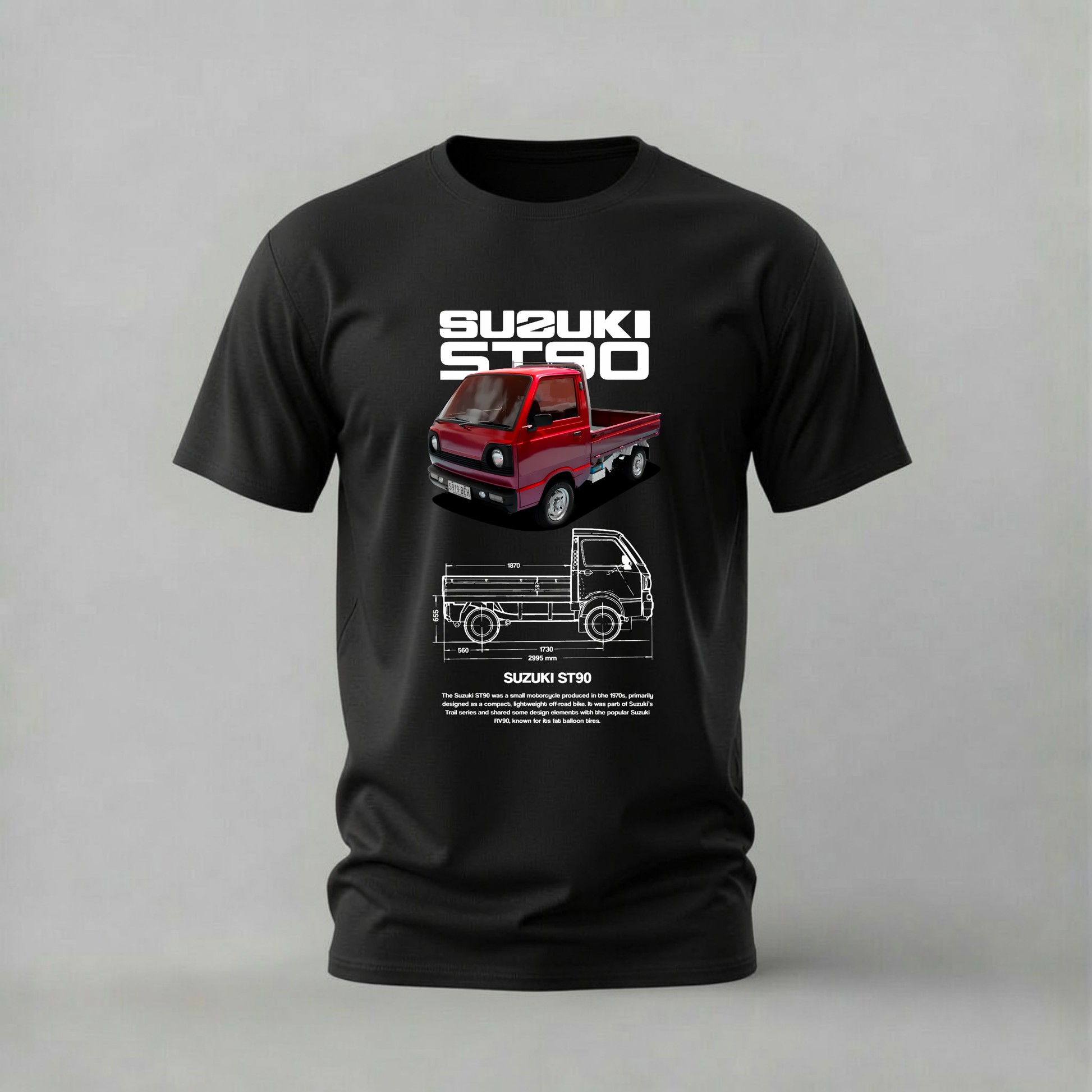 A black short-sleeve crewneck t-shirt featuring a graphic print of a red Suzuki Star mini truck and a technical blueprint diagram on the front, set against a neutral gray background.