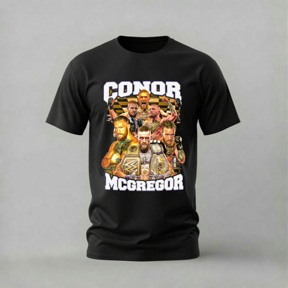 A black short-sleeve crewneck t-shirt featuring a large graphic print of WWE wrestler Conor McGregor with his name printed in bold white letters above and below the collage.