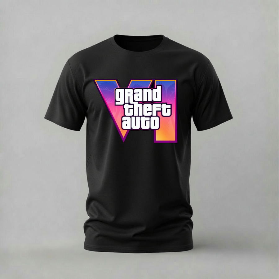 A black short-sleeve t-shirt featuring a large 'VI' graphic with the text 'grand theft auto' in white, set against a purple, pink, and orange gradient background, displayed on a neutral gray studio backdrop.
