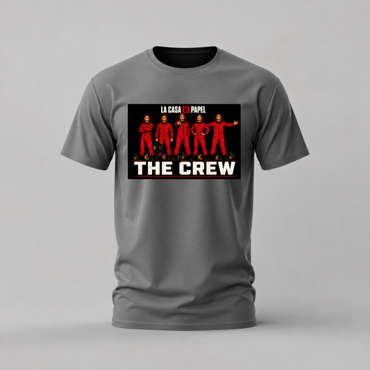 A gray short-sleeve crewneck t-shirt featuring a graphic print of the characters from 'La Casa de Papel' wearing red jumpsuits with the text 'THE CREW' in bold white letters.