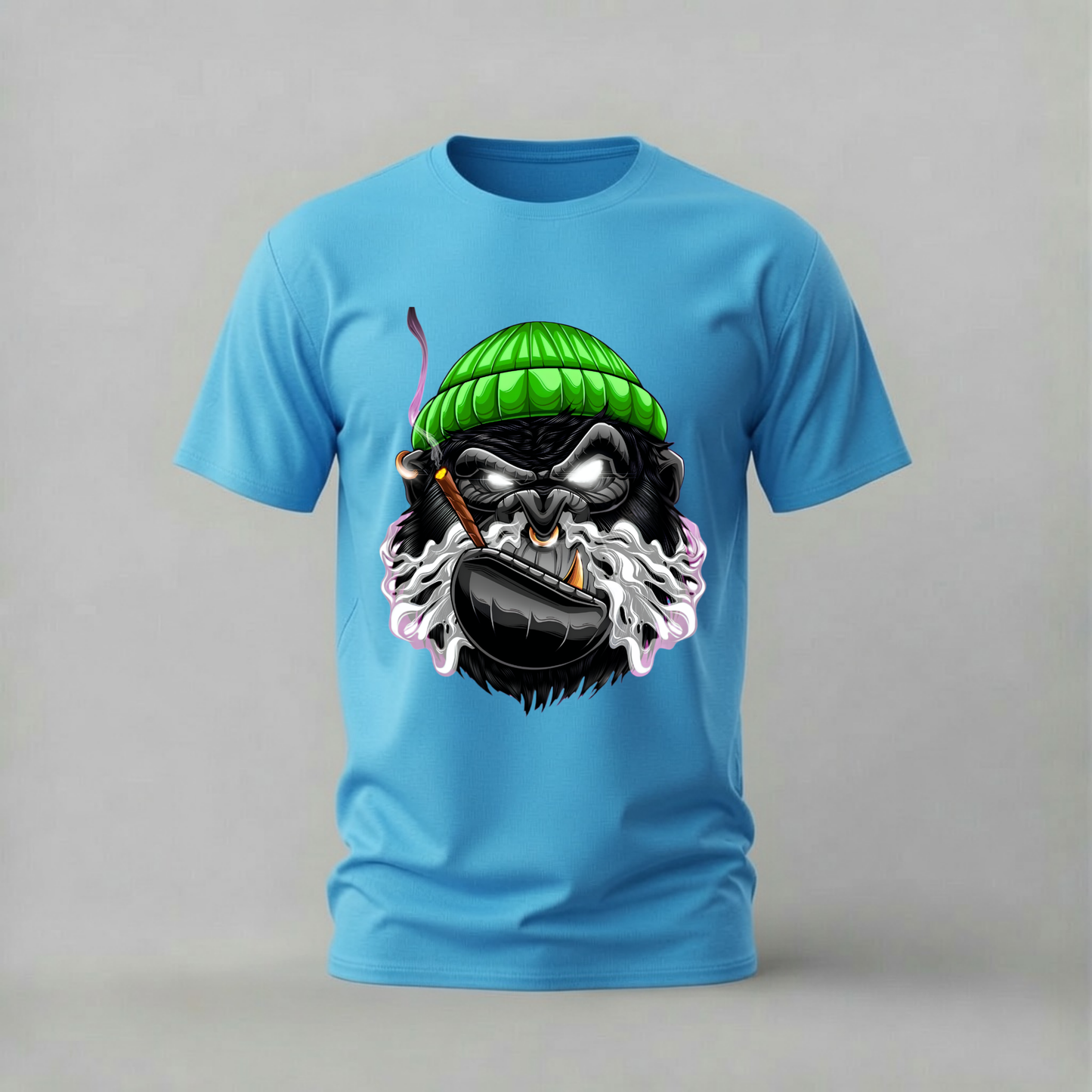 A light blue short-sleeve crewneck t-shirt featuring a graphic print of a cartoon gorilla wearing a green knit beanie and smoking a pipe, set against a plain gray background.