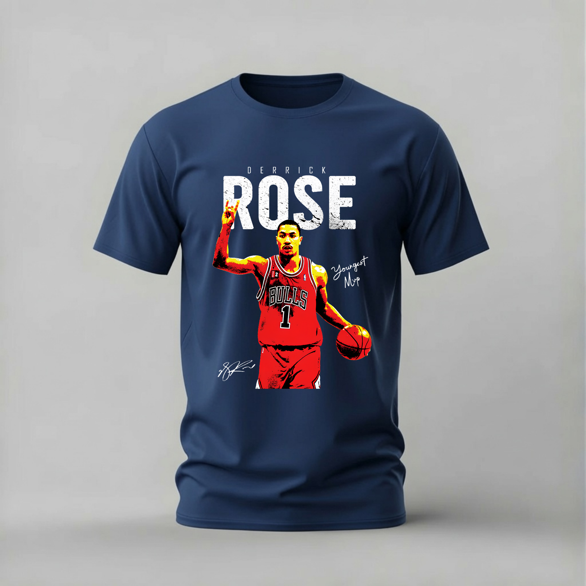 A navy blue short-sleeve t-shirt with a graphic print of basketball player Derrick Rose in a red Chicago Bulls jersey, featuring his name and signature on a light gray background.