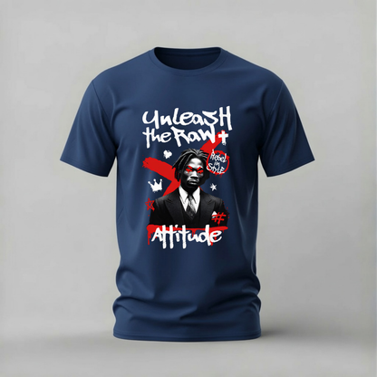 A navy blue short-sleeve t-shirt with a graphic print on the front, featuring the text 'Unleash the RAW+ Attitude' and a stylized portrait of a man, shown against a neutral gray background.