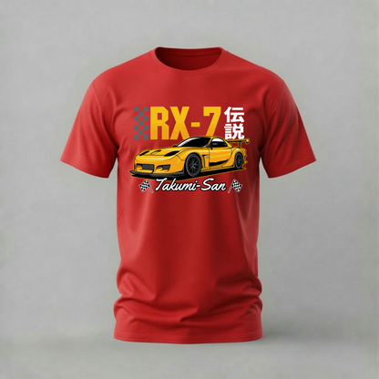 A red short-sleeve crewneck t-shirt featuring a graphic print of a yellow sports car with the text 'RX-7' and 'Takumi San' on a gray studio background.