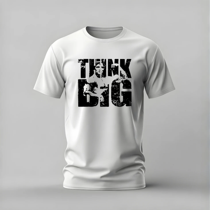 A white short-sleeve crewneck t-shirt with a distressed black graphic print on the front reading 'THINK BIG' with a portrait of Albert Einstein inside the letters, shown on a neutral gray background.