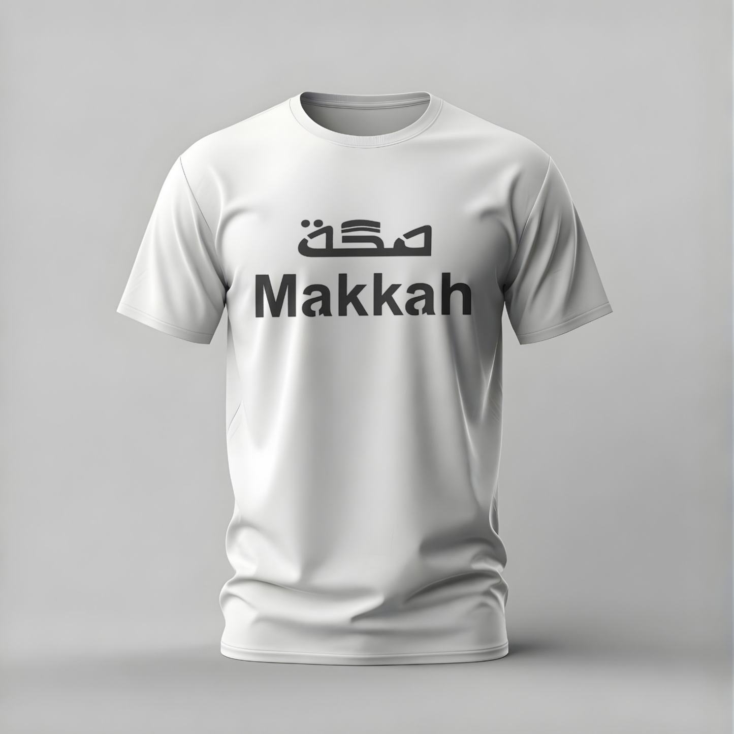White t-shirt with 'Makkah' text on a gray background