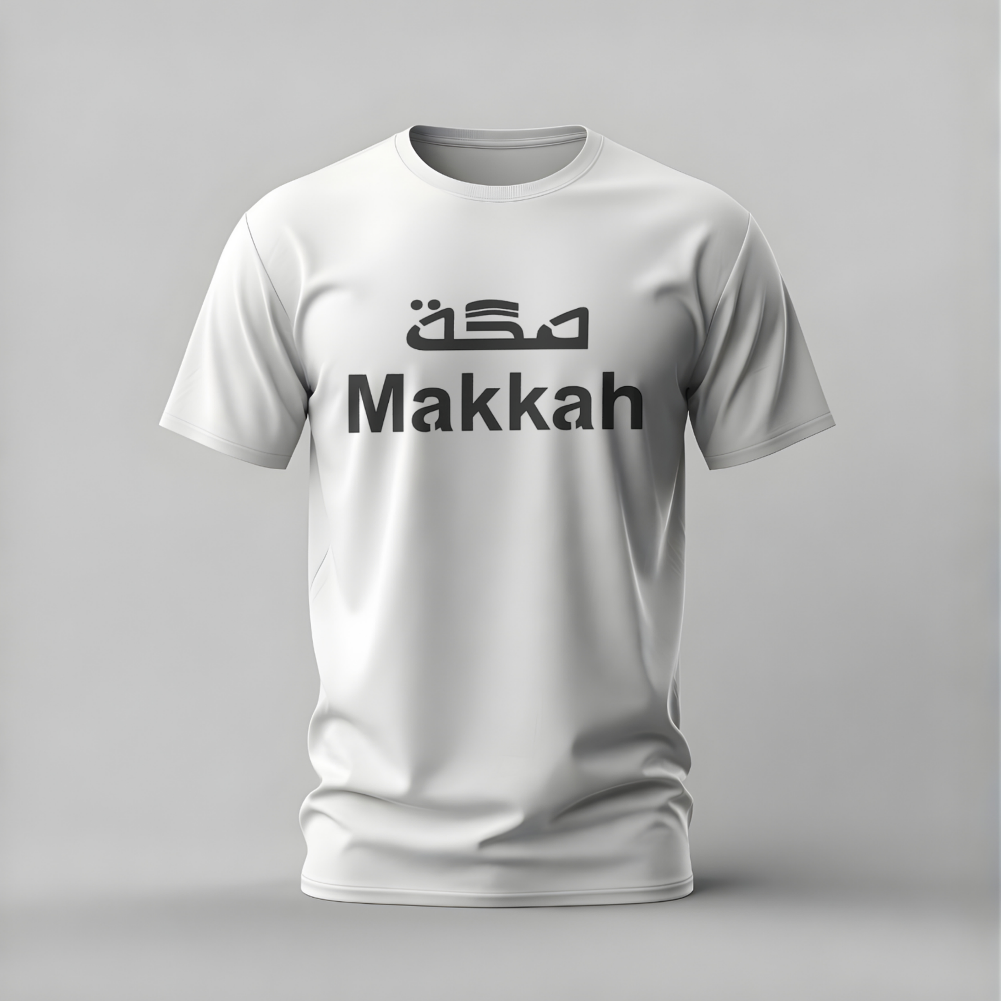 White t-shirt with 'Makkah' text on a gray background