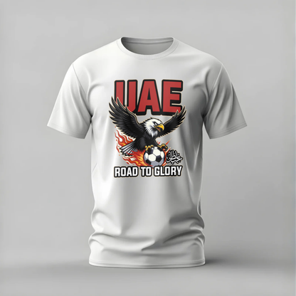 White t-shirt with UAE eagle and soccer ball design on a gray background