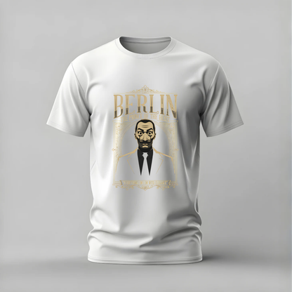 A white short-sleeve crewneck t-shirt with a gold and black graphic print on the front featuring the word 'BERLIN' and an illustrated portrait, displayed on a neutral gray background.